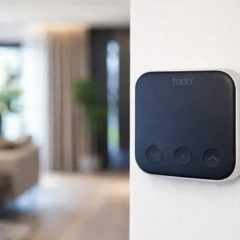 Smart thermostat mounted on a wall